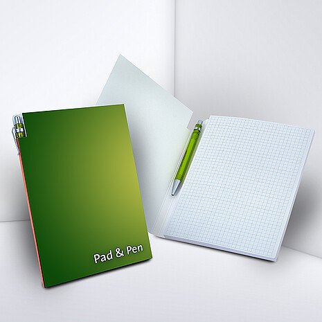 Note pad made from white paper with pen holder and printed cardboard cover