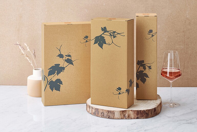 Gift packaging in natural shades with blue vine leaves