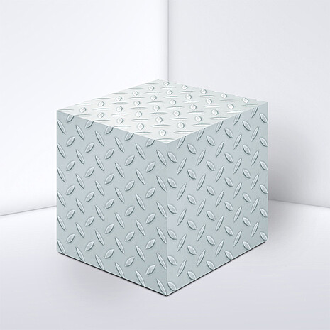 Note cube made from white paper with chequer plate print