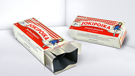Folding boxes with integrated lining for processed cheese