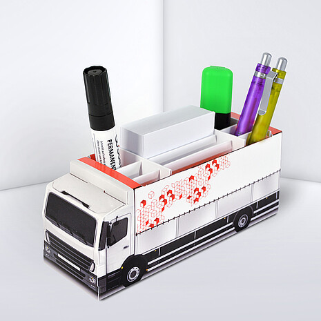 Printed cardboard box in shape of a truck, with space for office utensils and sheets
