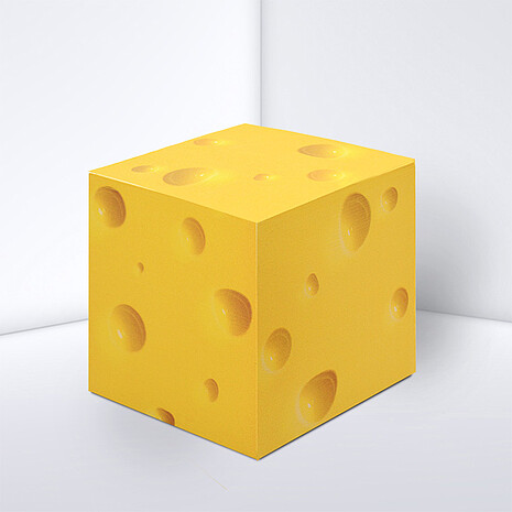 Note cube made from white paper with cheese print
