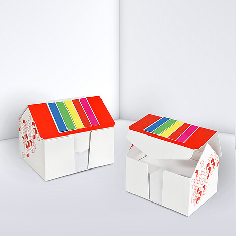 Printed cardboard box in shape of a house, with sheets and markerset