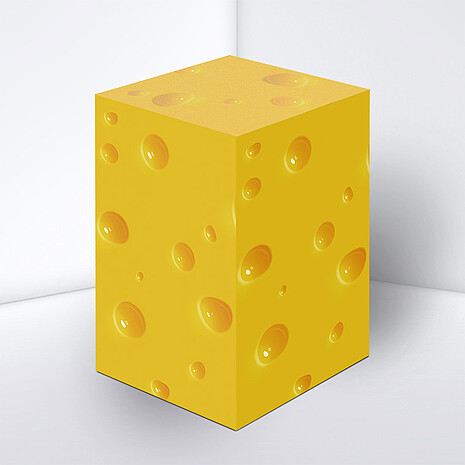 Note cube made from white paper with cheese print