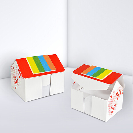 Printed cardboard box in shape of a house, with sheets and markerset