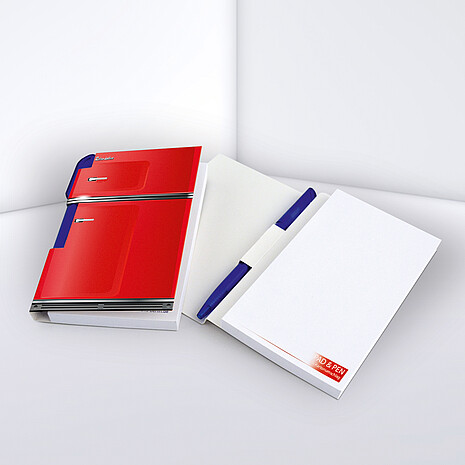 Note pad made from white paper with pen holder and printed cardboard cover