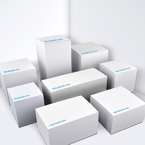 Note cube made from white paper in various sizes