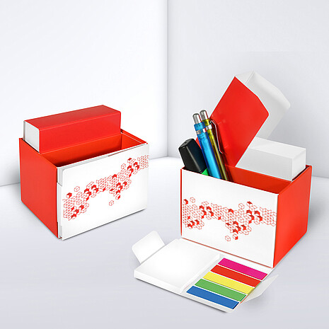 Printed cardboard box with space for office utensils, sheets, adhesive notes and marker set