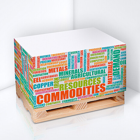 Note cube made from white paper with side print on a mini wooden pallet