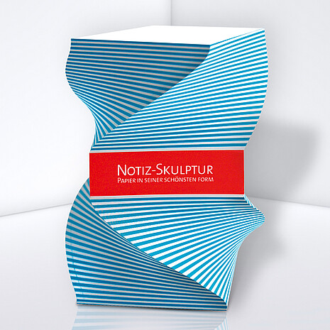 Shaped note cube made from white paper with side print